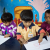 Three little children at the creche drawing pictures.