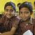 boys holding school books