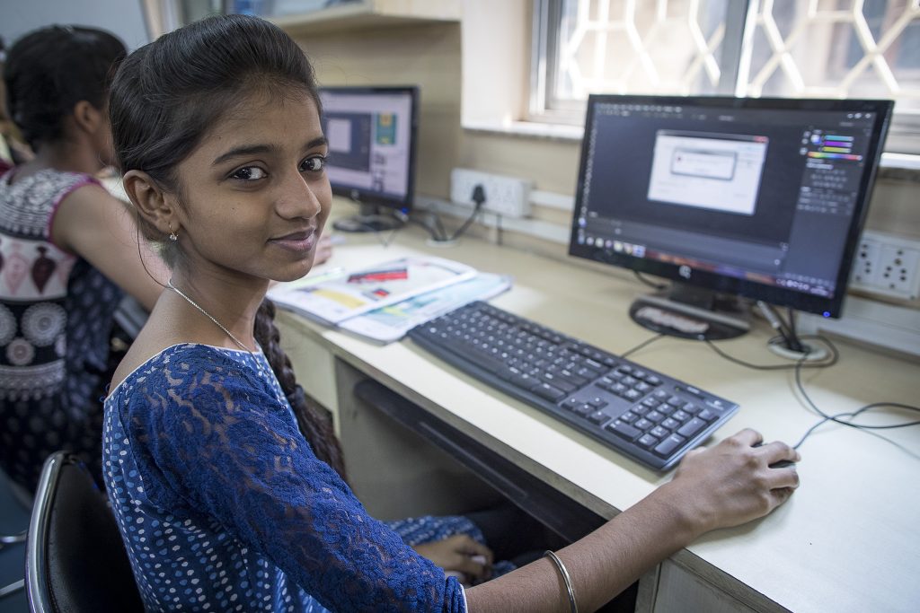 A young girl using a computer