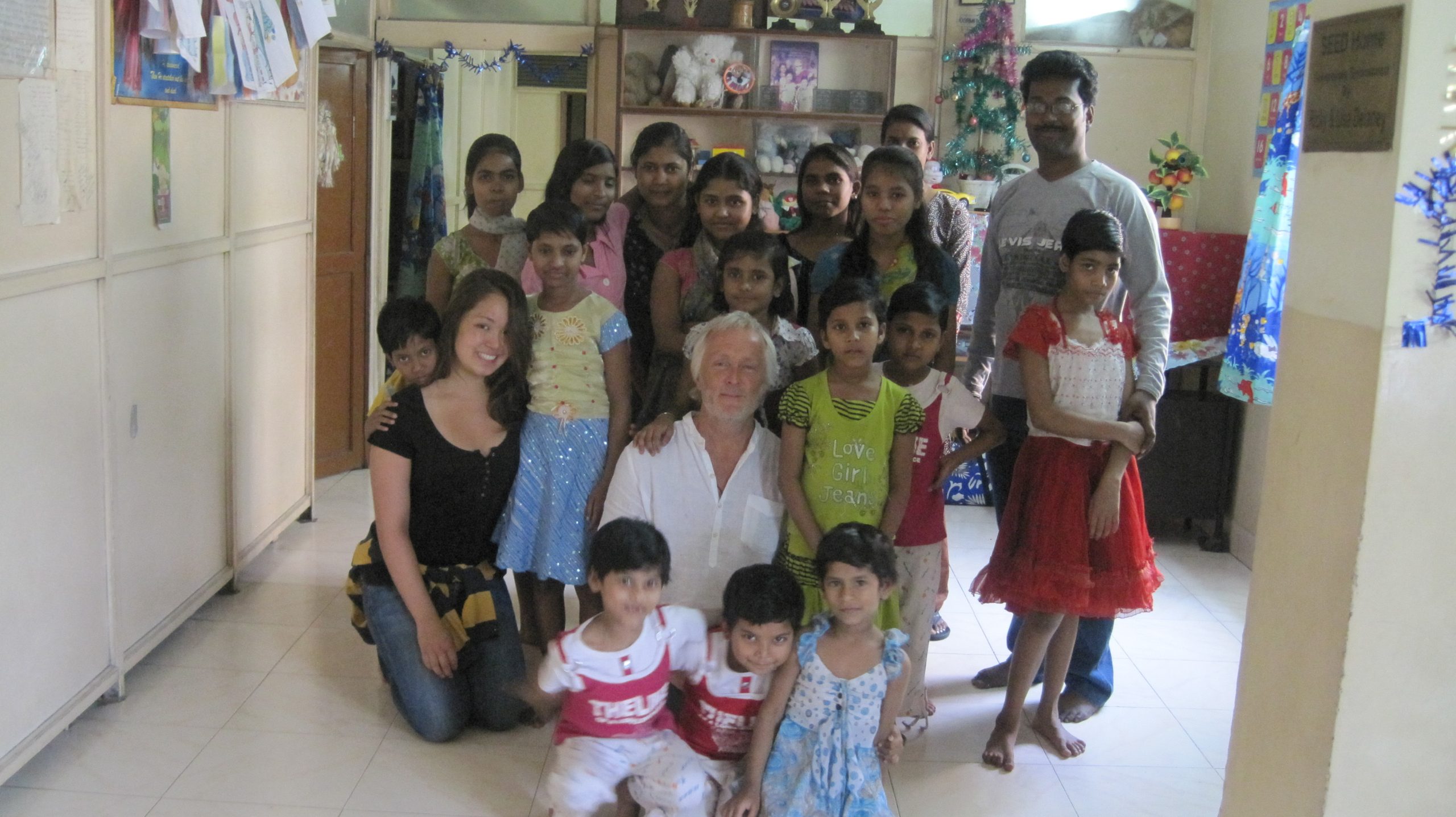 Simon and his daughter Samantha with children from HOPE's programmes
