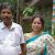Shobha wearing a sari standing next to her husband