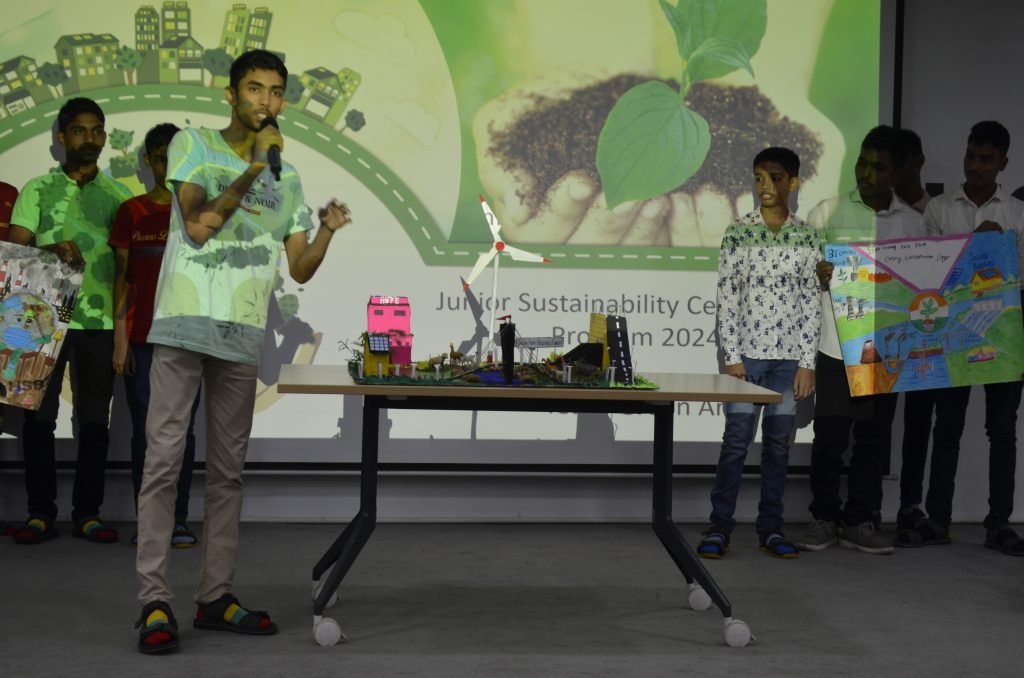 A boy gives a presentation at the Green Training Initiative Programme